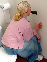 RelaXXX presents: Blonde girl Jamie sits on the toilet and blows a black gloryhole dong
